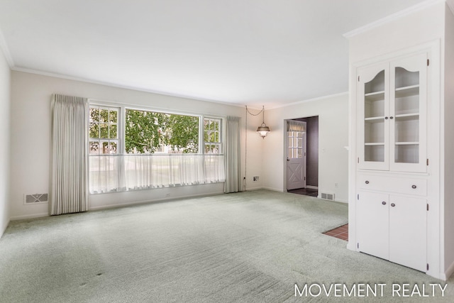 1001 Cricklewood St SW, Wyoming, MI 49509 - empty room with ornamental molding, carpet, and baseboards