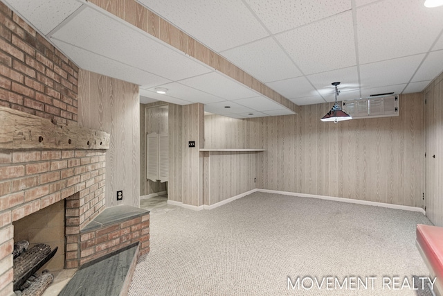 1001 Cricklewood St SW, Wyoming, MI 49509 - finished below grade area featuring carpet floors, a fireplace, a paneled ceiling, wooden walls, and baseboards