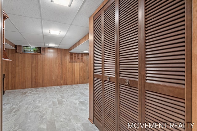 1001 Cricklewood St SW, Wyoming, MI 49509 - corridor with wood walls, a drop ceiling, and a heating unit