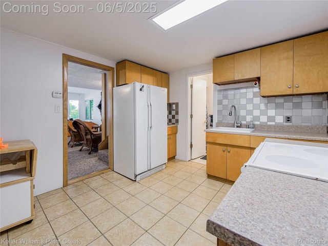 227 Ora Rd, Oxford, MI 48371 - kitchen featuring freestanding refrigerator, a sink, light countertops, and tasteful backsplash