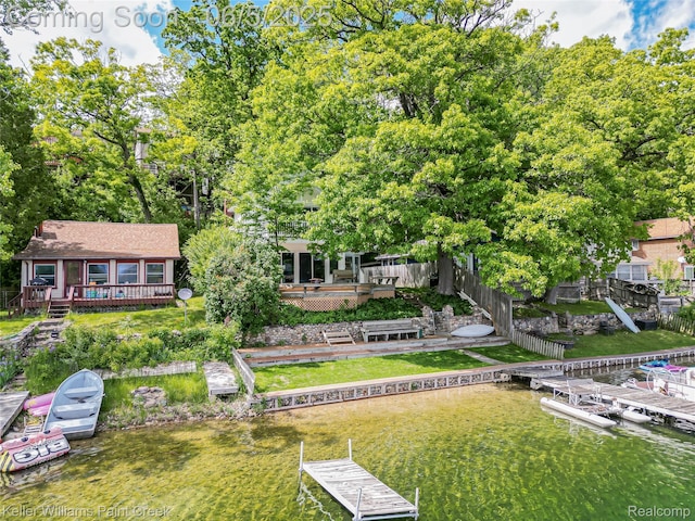 227 Ora Rd, Oxford, MI 48371 - rear view of property with a deck with water view and view of scattered trees