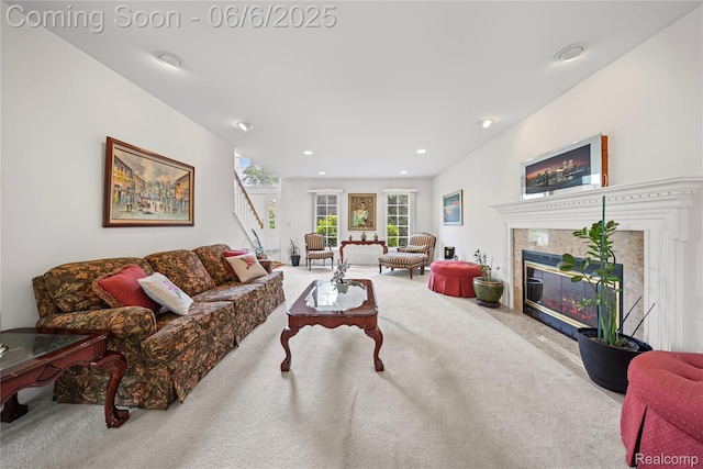 2105 Rob Rdg, Commerce Twp, MI 48390 - living area featuring carpet flooring, stairs, a fireplace, and recessed lighting