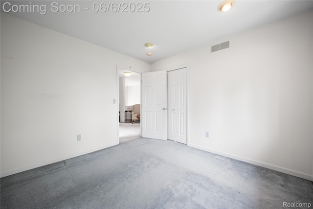 2105 Rob Rdg, Commerce Twp, MI 48390 - unfurnished bedroom with carpet floors, a closet, and baseboards