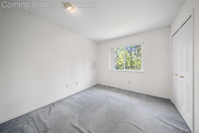 2105 Rob Rdg, Commerce Twp, MI 48390 - unfurnished bedroom featuring carpet floors, baseboards, and a closet