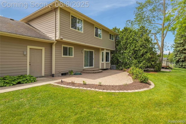 2105 Rob Rdg, Commerce Twp, MI 48390 - rear view of house with a yard and a patio area