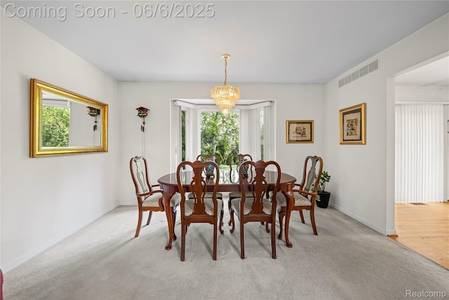 2105 Rob Rdg, Commerce Twp, MI 48390 - dining area with baseboards and light carpet