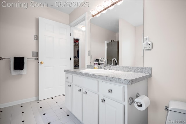 2105 Rob Rdg, Commerce Twp, MI 48390 - full bath with vanity, toilet, tile patterned flooring, and baseboards
