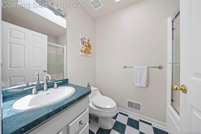 2105 Rob Rdg, Commerce Twp, MI 48390 - full bathroom featuring a shower with shower door, vanity, toilet, and tile patterned floors
