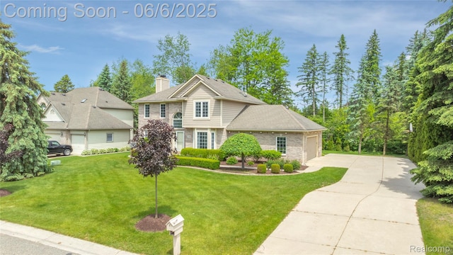 2105 Rob Rdg, Commerce Twp, MI 48390 - view of front of house featuring concrete driveway, an attached garage, a front yard, a chimney, and brick siding