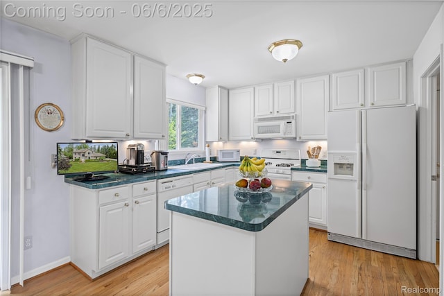 2105 Rob Rdg, Commerce Twp, MI 48390 - kitchen featuring white appliances, a sink, white cabinetry, and light wood-style floors