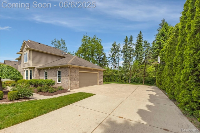 2105 Rob Rdg, Commerce Twp, MI 48390 - view of side of property with brick siding, driveway, a garage, and roof with shingles