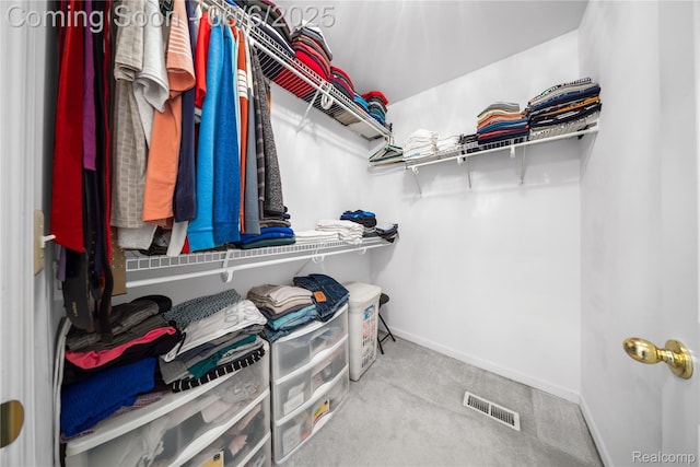 2105 Rob Rdg, Commerce Twp, MI 48390 - walk in closet featuring carpet floors