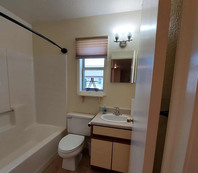 202 E Water Ave, Oscoda, MI 48750 - full bathroom with vanity, toilet, shower / tub combination, and a textured wall