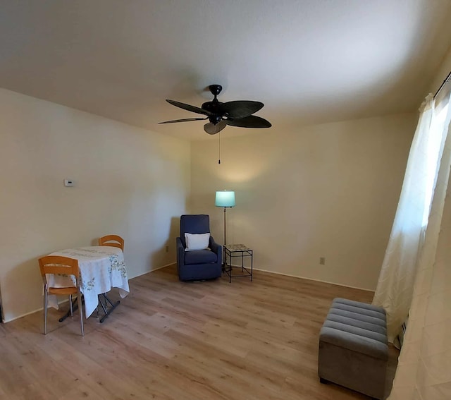 202 E Water Ave, Oscoda, MI 48750 - living area with wood finished floors and a ceiling fan