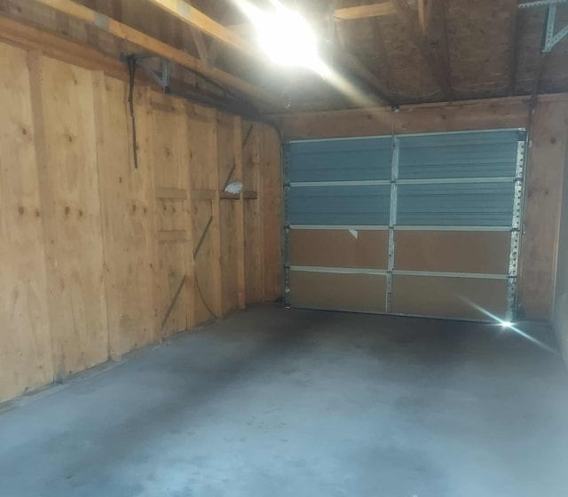 202 E Water Ave, Oscoda, MI 48750 - garage featuring wooden walls