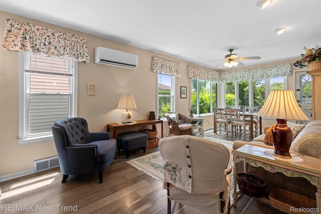 4044 Fieldview Ave, West Bloomfield, MI 48324 - living area featuring an AC wall unit, a ceiling fan, hardwood / wood-style floors, and baseboards