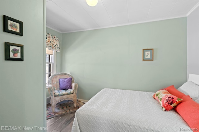 4044 Fieldview Ave, West Bloomfield, MI 48324 - bedroom with ornamental molding, wood finished floors, and baseboards