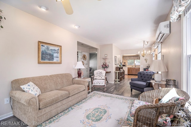 4044 Fieldview Ave, West Bloomfield, MI 48324 - living area featuring a wall unit AC, wood finished floors, a chandelier, baseboards, and ceiling fan