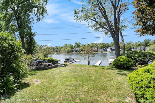 4044 Fieldview Ave, West Bloomfield, MI 48324 - view of green lawn featuring a boat dock and a water view