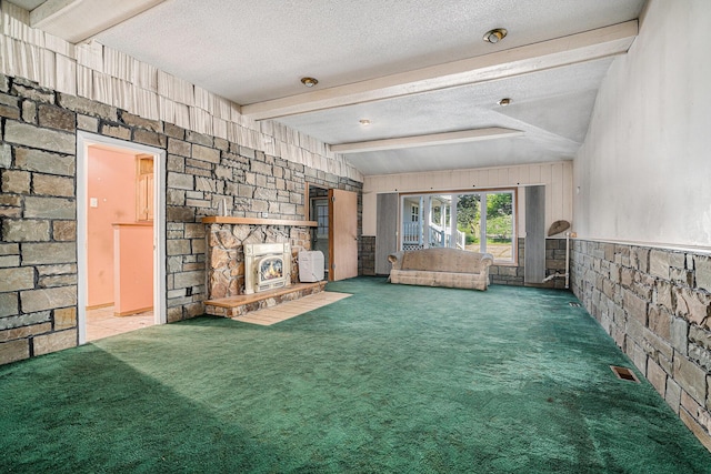 19146 Fairchild Rd, Constantine, MI 49042 - unfurnished living room featuring carpet and a textured ceiling