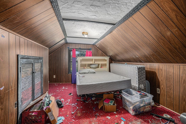 19146 Fairchild Rd, Constantine, MI 49042 - carpeted bedroom featuring wooden walls and lofted ceiling