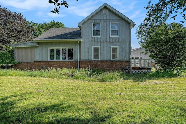 19146 Fairchild Rd, Constantine, MI 49042 - rear view of property with a lawn, a wooden deck, and roof with shingles