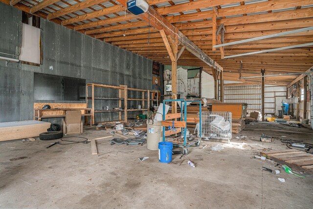 19146 Fairchild Rd, Constantine, MI 49042 - garage featuring a garage door opener