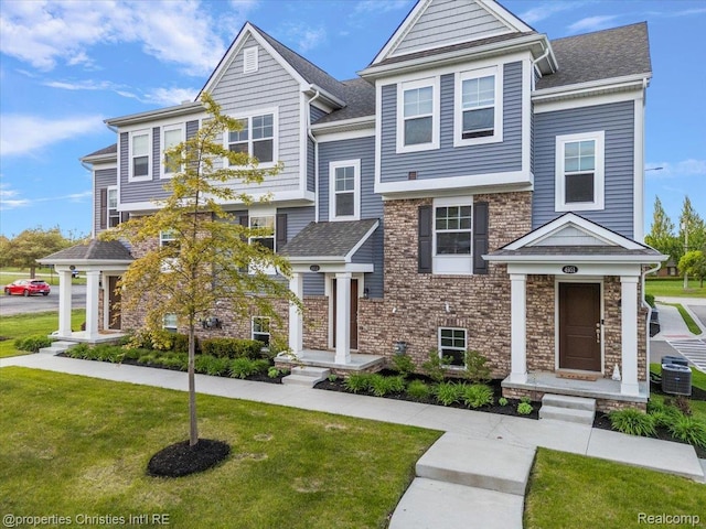 4953 Treeside Ln, Troy, MI 48098 - view of front of home featuring a front lawn and brick siding