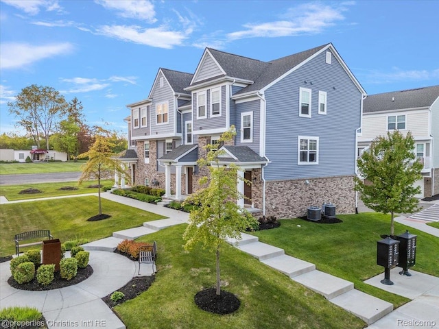 4953 Treeside Ln, Troy, MI 48098 - view of front of house with stone siding and a front yard