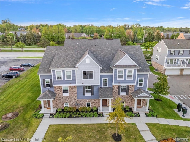 4953 Treeside Ln, Troy, MI 48098 - view of front of home featuring stone siding, uncovered parking, and a front lawn