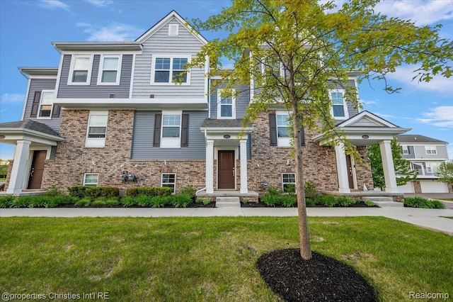 4953 Treeside Ln, Troy, MI 48098 - view of front facade with a front lawn and brick siding