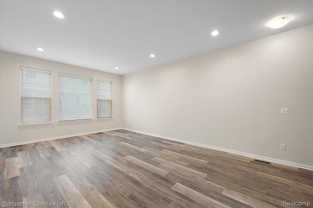 4953 Treeside Ln, Troy, MI 48098 - unfurnished room with wood finished floors and recessed lighting