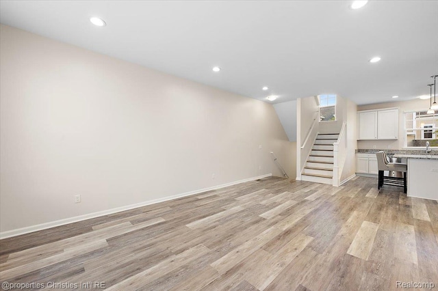 4953 Treeside Ln, Troy, MI 48098 - unfurnished living room featuring stairway, light wood-style floors, and recessed lighting