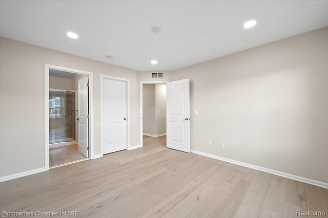 4953 Treeside Ln, Troy, MI 48098 - unfurnished bedroom featuring light wood finished floors, recessed lighting, and connected bathroom