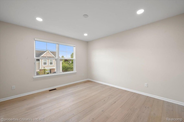 4953 Treeside Ln, Troy, MI 48098 - spare room with wood finished floors and recessed lighting
