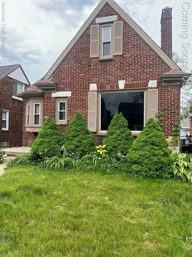 18611 Monica St, Detroit, MI 48221 - rear view of house with brick siding and a chimney