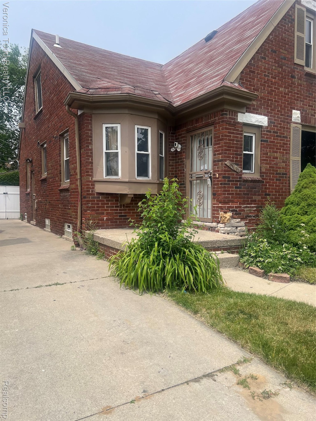 18611 Monica St, Detroit, MI 48221 - view of front of home with brick siding and roof with shingles