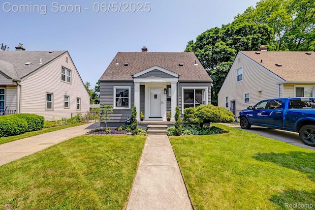 2231 Parker St, Dearborn, MI 48124 - view of front of property with a front yard and roof with shingles