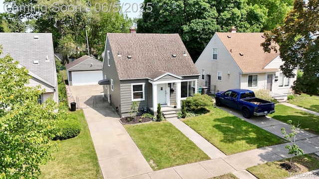 2231 Parker St, Dearborn, MI 48124 - view of front of house featuring an outbuilding, a shingled roof, a garage, and a front lawn