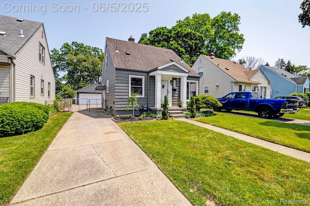 2231 Parker St, Dearborn, MI 48124 - bungalow-style home featuring an outdoor structure, a garage, roof with shingles, and a residential view