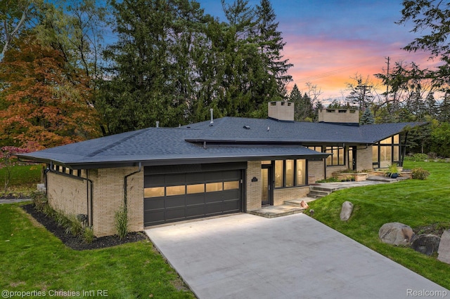 1093 Greentree Rd, Bloomfield Hills, MI 48304 - view of front facade featuring brick siding, a front lawn, driveway, and roof with shingles