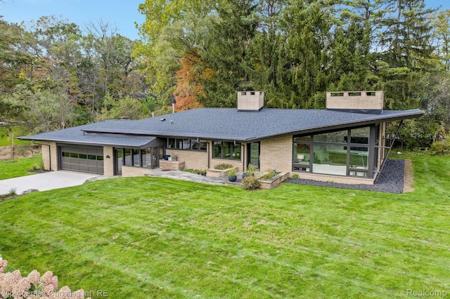 1093 Greentree Rd, Bloomfield Hills, MI 48304 - view of front of house featuring a chimney, concrete driveway, a front lawn, a garage, and a shingled roof