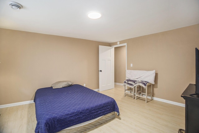 2635 E River Rd, Twin Lake, MI 49457 - bedroom with light wood-style floors and baseboards