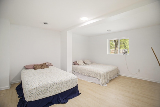 2635 E River Rd, Twin Lake, MI 49457 - bedroom featuring wood finished floors and baseboards