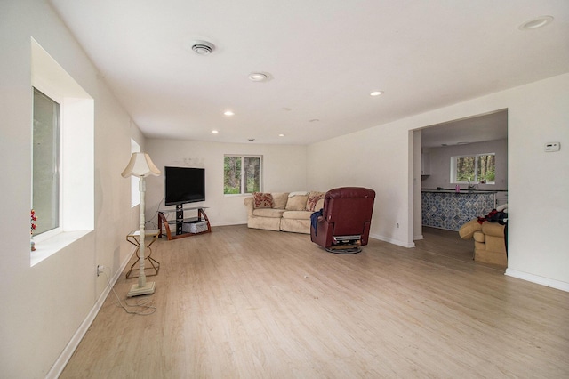 2635 E River Rd, Twin Lake, MI 49457 - living room with wood finished floors, baseboards, and recessed lighting