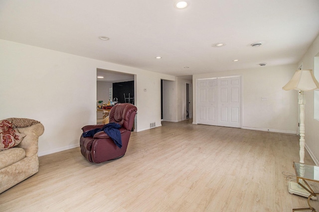 2635 E River Rd, Twin Lake, MI 49457 - living area featuring wood finished floors, baseboards, and recessed lighting