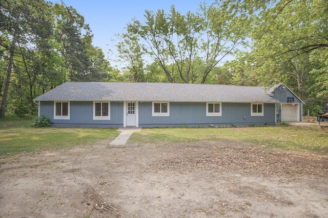 2635 E River Rd, Twin Lake, MI 49457 - ranch-style house with dirt driveway, a front yard, and roof with shingles