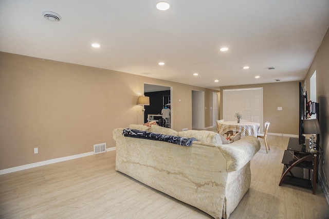 2635 E River Rd, Twin Lake, MI 49457 - living room with light wood finished floors, recessed lighting, and baseboards