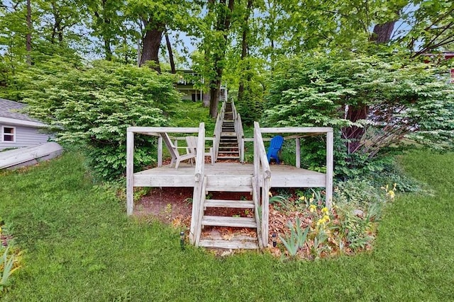 14883 Hideaway Dr, Vandalia, MI 49095 - view of playground featuring stairs, a deck, and a yard