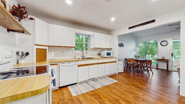 14883 Hideaway Dr, Vandalia, MI 49095 - kitchen featuring white appliances, a sink, light countertops, backsplash, and recessed lighting